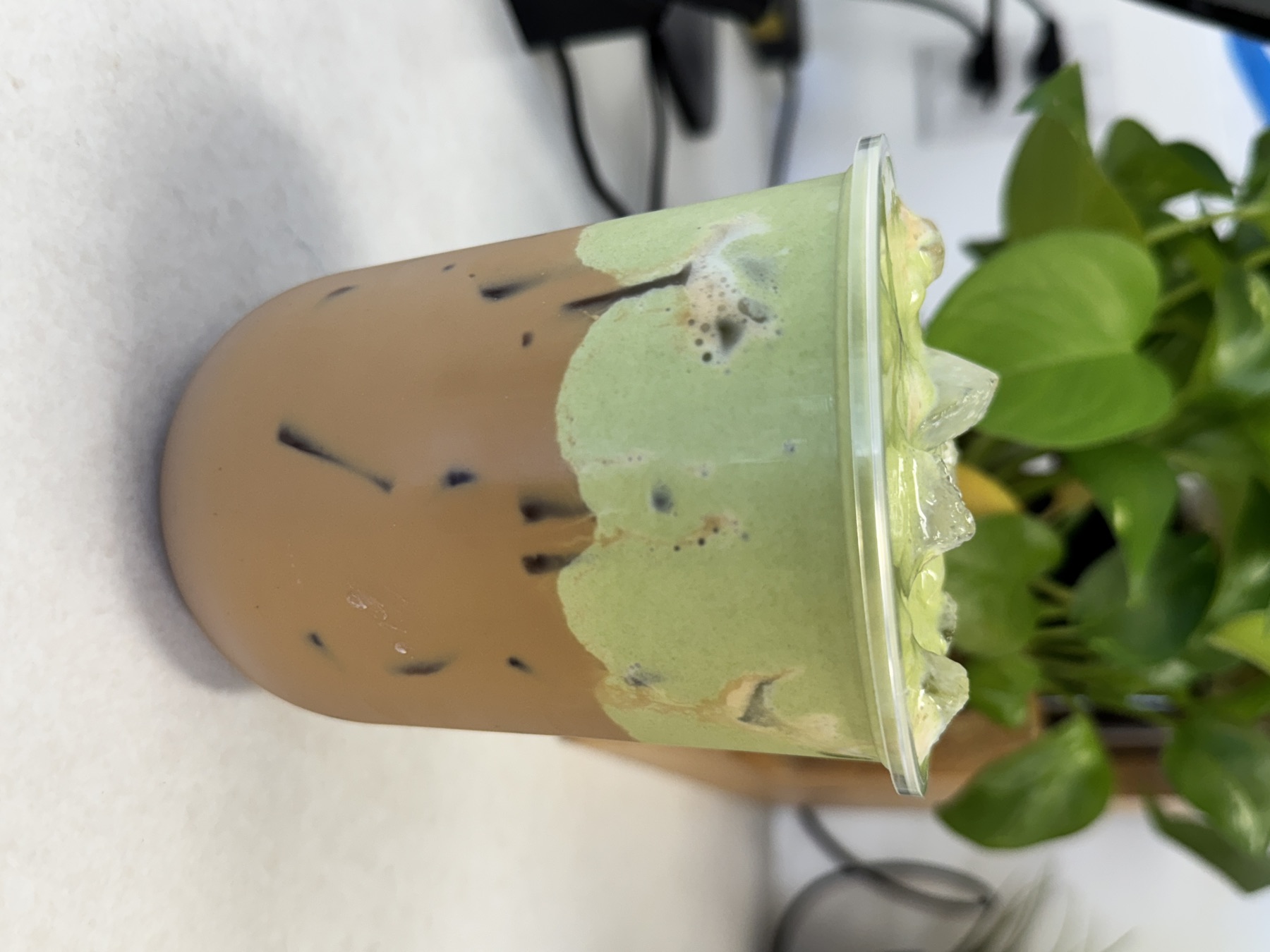 Coconut matcha over iced milk tea with green and cream layers